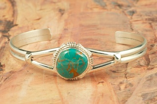 Genuine Pilot Mountain Turquoise set in Sterling Silver Bracelet. The Pilot Mountain Mine is located in Esmeralda County, Nevada. Created by Navajo Artist Kathy Yazzie. Signed by the artist.